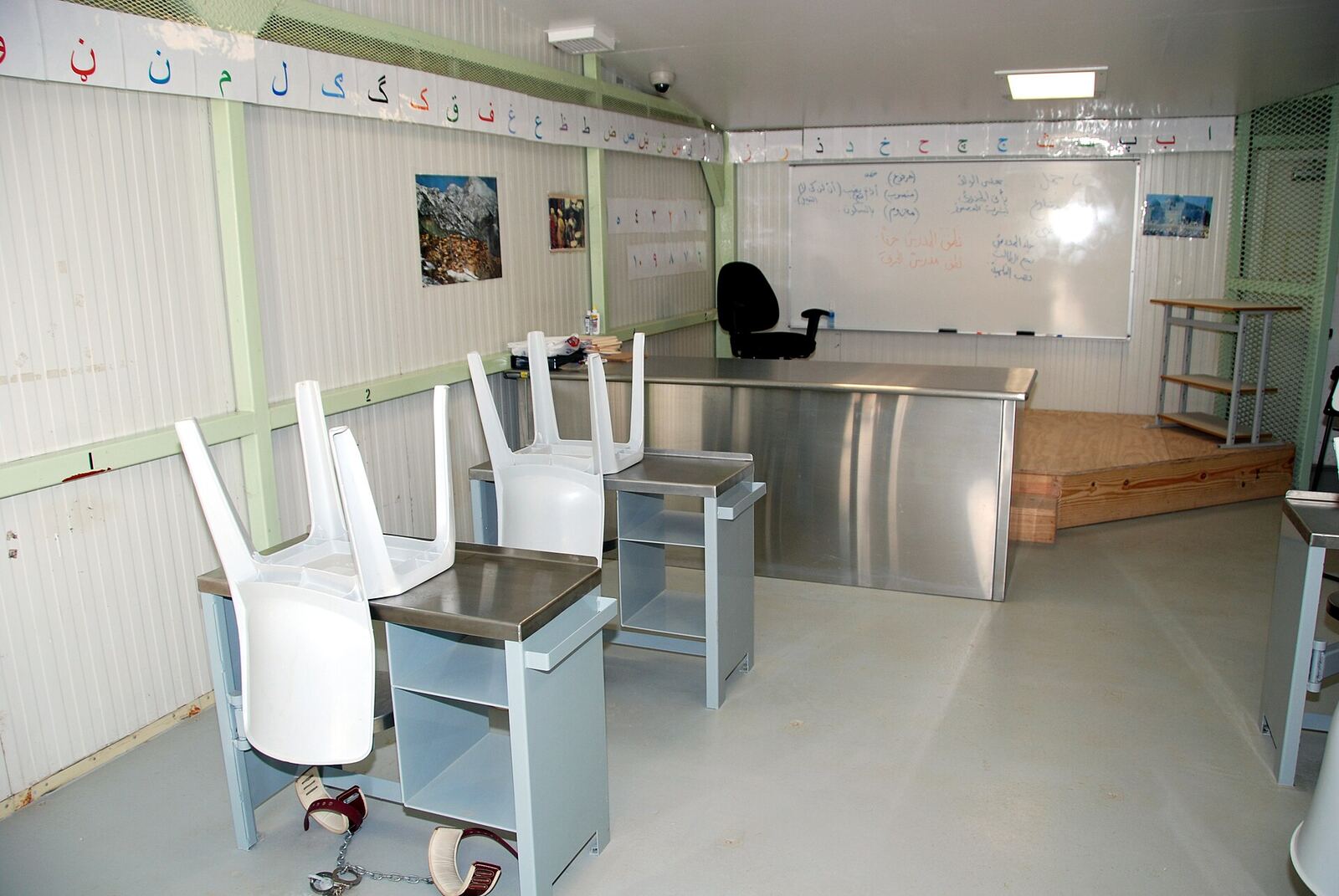 Classroom | RaspGold English A classroom with desks and chairs provides a learning environment for English language students.