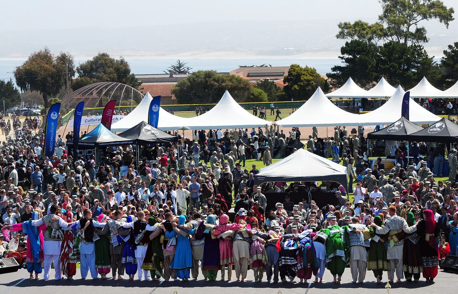 Cultural Festival | RaspGold English A large crowd enjoys a cultural festival, showcasing opportunities for real-world communication skills.