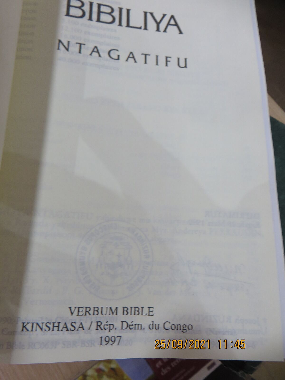 Kinyarwanda Bible | RaspGold English An open Bible in Kirundi with details from Kinshasa, Congo, illustrating language and cultural context for english lessons.
