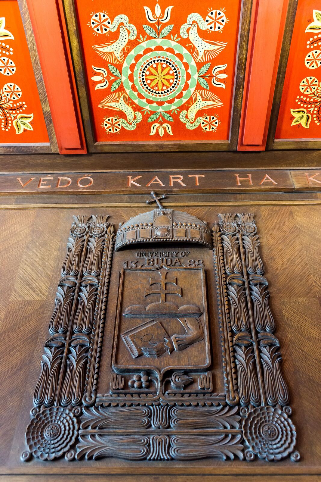 University of Buda | RaspGold English A detailed wooden plaque displaying 'University of Buda 1388' is set into a floor, showcasing historical architecture and.